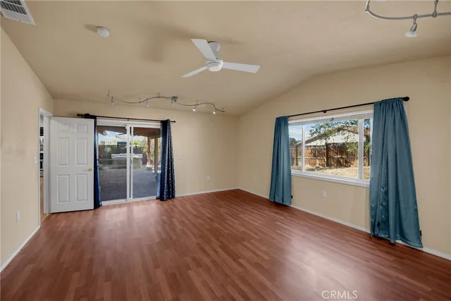 a kitchen with a sink appliances and cabinets