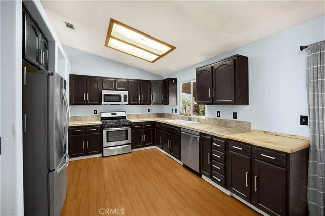 front view of a house next to a yard