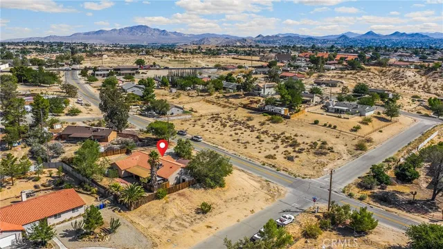an aerial view of a house with a garden