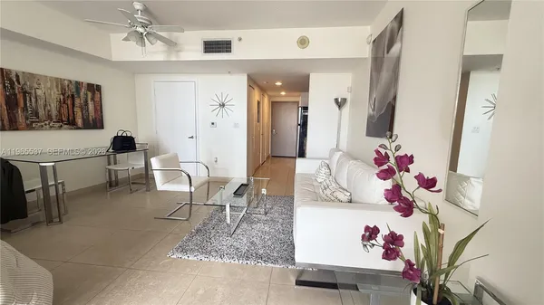 a living room with furniture and a table