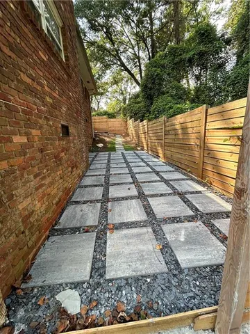 a view of a yard with wooden stairs