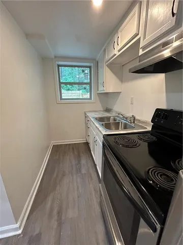a kitchen with a stove and a microwave