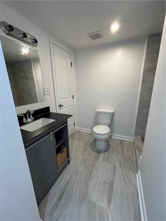 1665 Avon Avenue Southwest Atlanta, GA 30311 - Photo 10 of 15 a view of a bathroom with a sink and a toilet