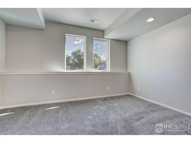 a view of an empty room with stairs