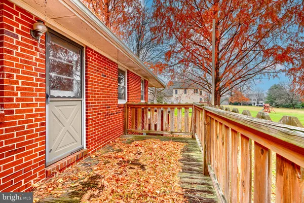 a view of a pathway with a house in the background