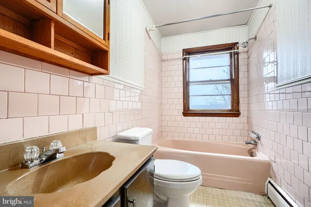 a bathroom with a sink and toilet