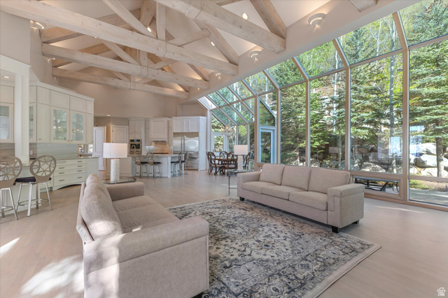3222 Eagle View Circle Sandy, UT 84092 - Photo 14 of 60 Living room with a sunroom, light wood-type flooring, and floor to ceiling windows