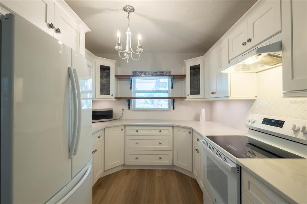 314 4th Avenue Southwest Ruskin, FL 33570 - Photo 9 of 30 a kitchen with a sink a refrigerator and window