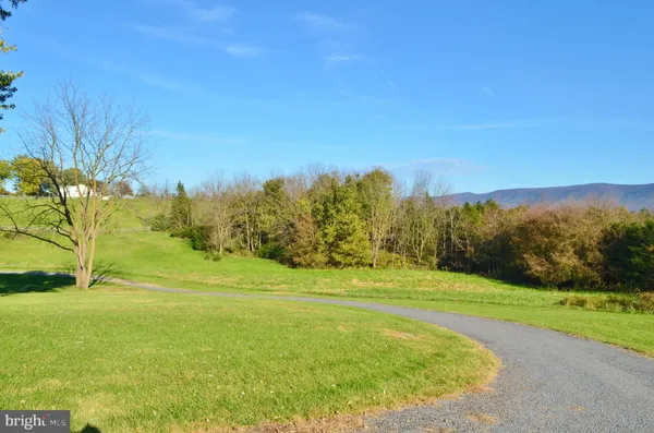 a view of a golf course with a lake