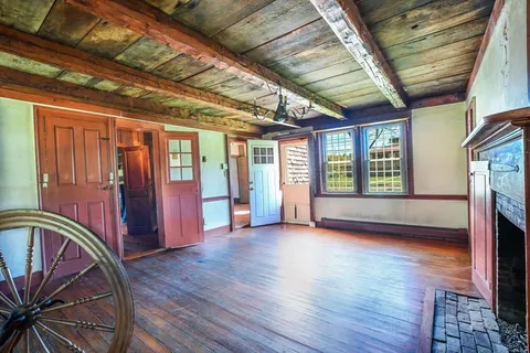 a kitchen with a stove sink and cabinets