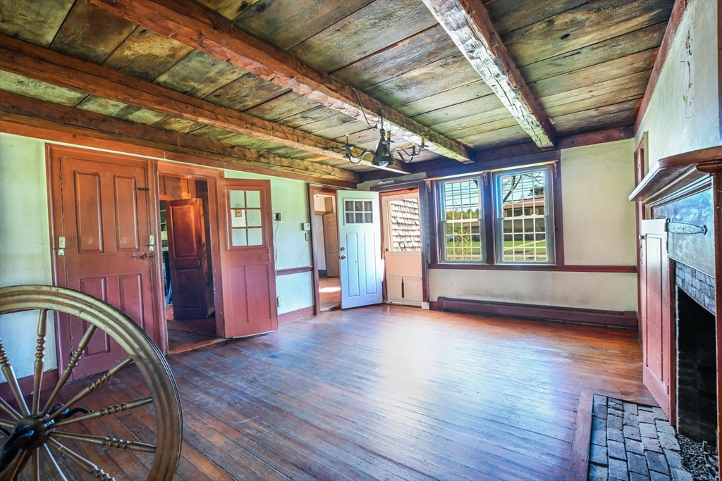 363 Main Street Acushnet, MA 02743 - Photo 16 of 35 a view of an empty room with wooden floor and a window