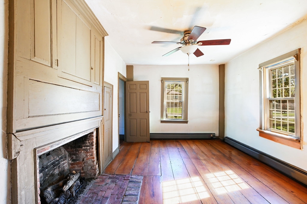 363 Main Street Acushnet, MA 02743 - Photo 20 of 35 a view of empty room with wooden floor and fan