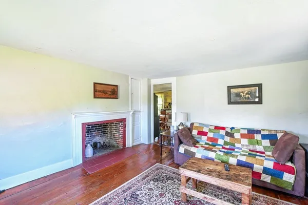 a bathroom with a toilet a sink and a shower curtain