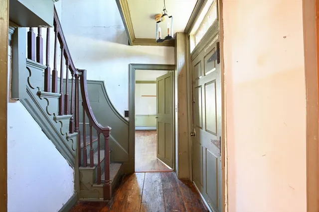 a view of an entryway with wooden floor