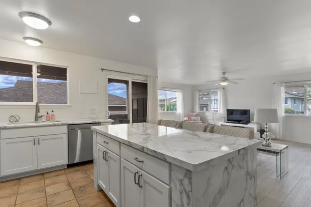 a kitchen with a stove a sink and a refrigerator