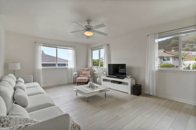 a living room with furniture and a table