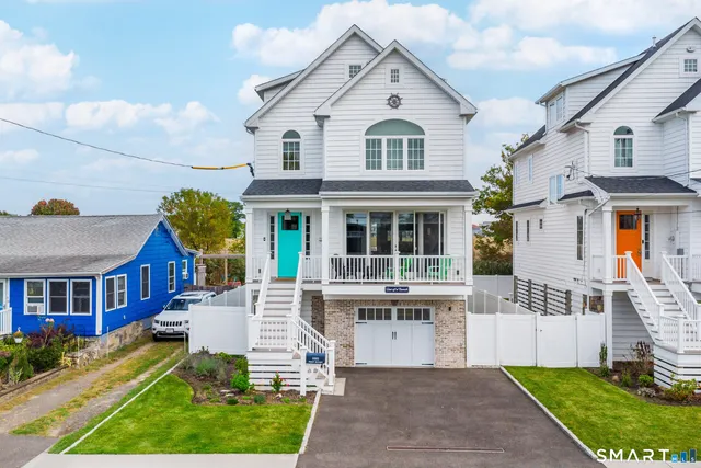 a view of house with a yard