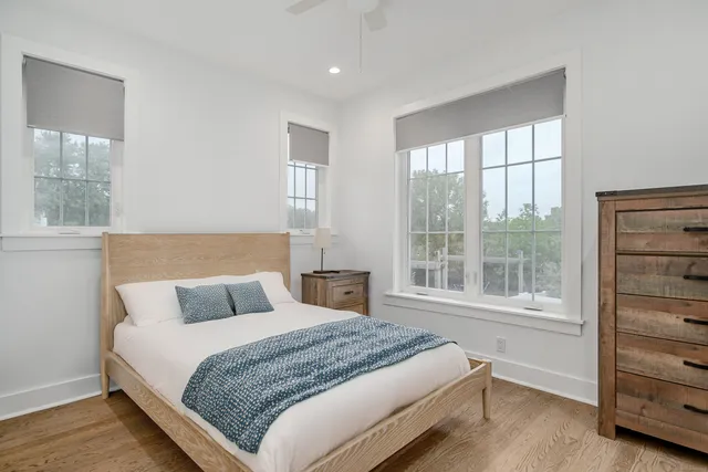 a bedroom with a large bed and a window