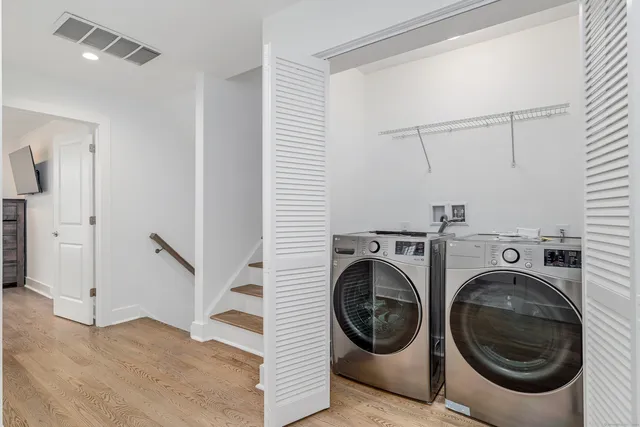a view of a hallway with washer and dryer