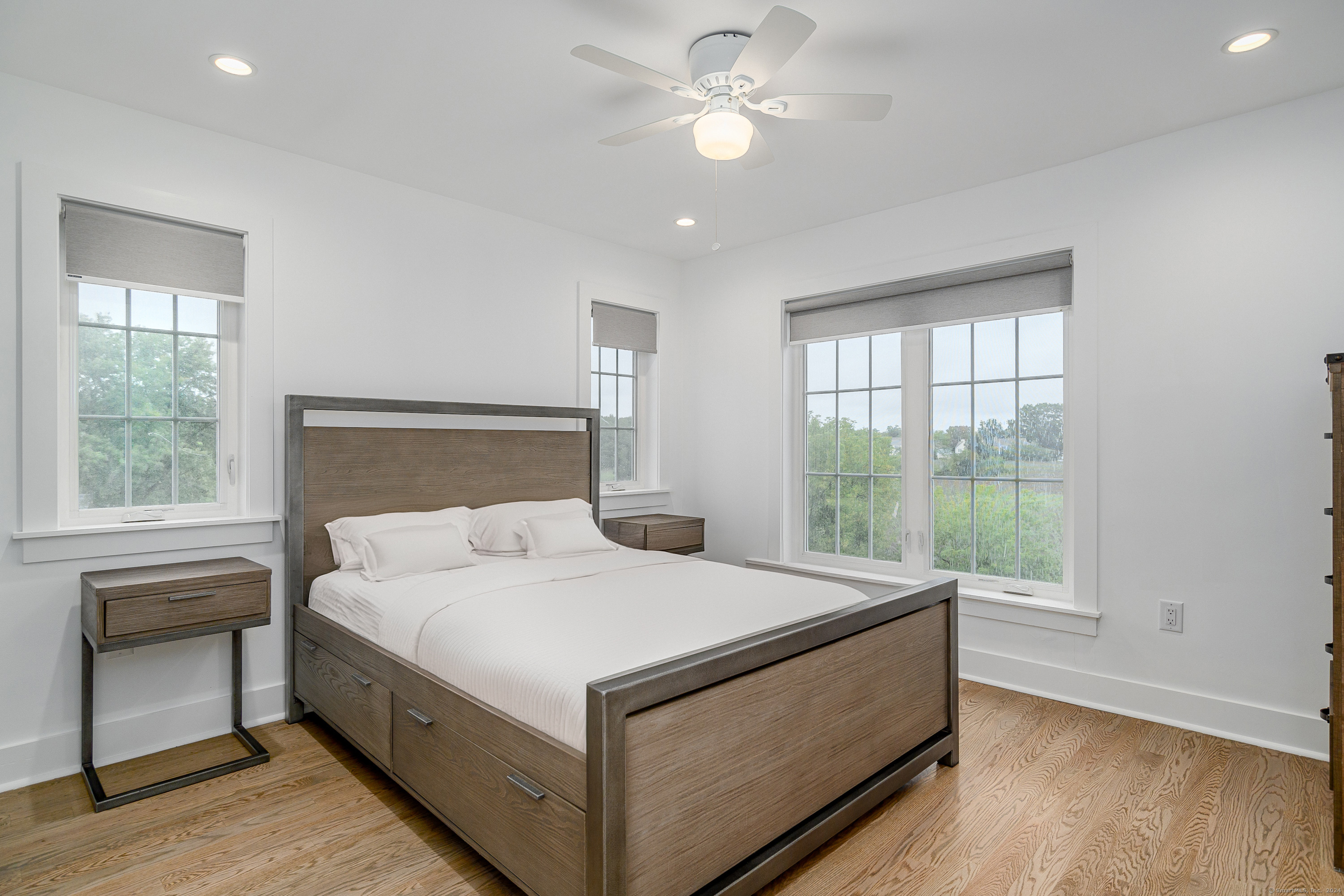 1033 Reef Road Fairfield, CT 06824 - Photo 15 of 32 a bedroom with a bed and a window