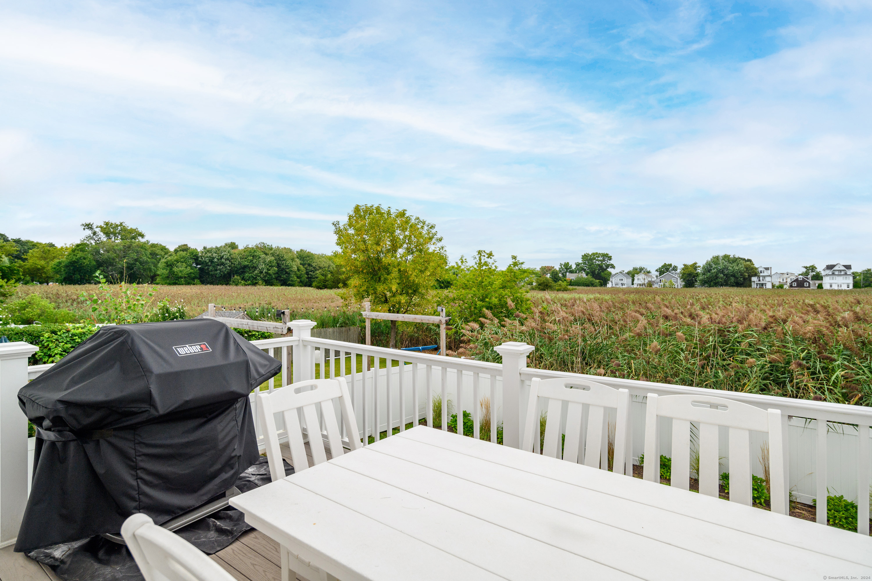 1033 Reef Road Fairfield, CT 06824 - Photo 23 of 32 a roof deck view with a garden