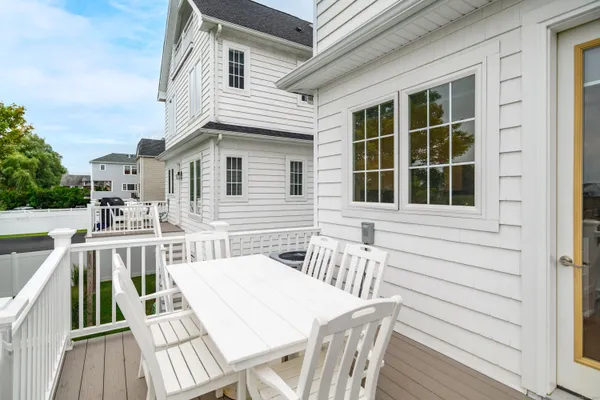 a view of a house with a wooden deck