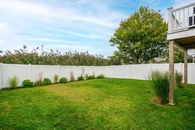 a backyard of a house with lots of green space