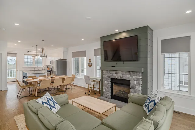 a living room with furniture fireplace and flat screen tv