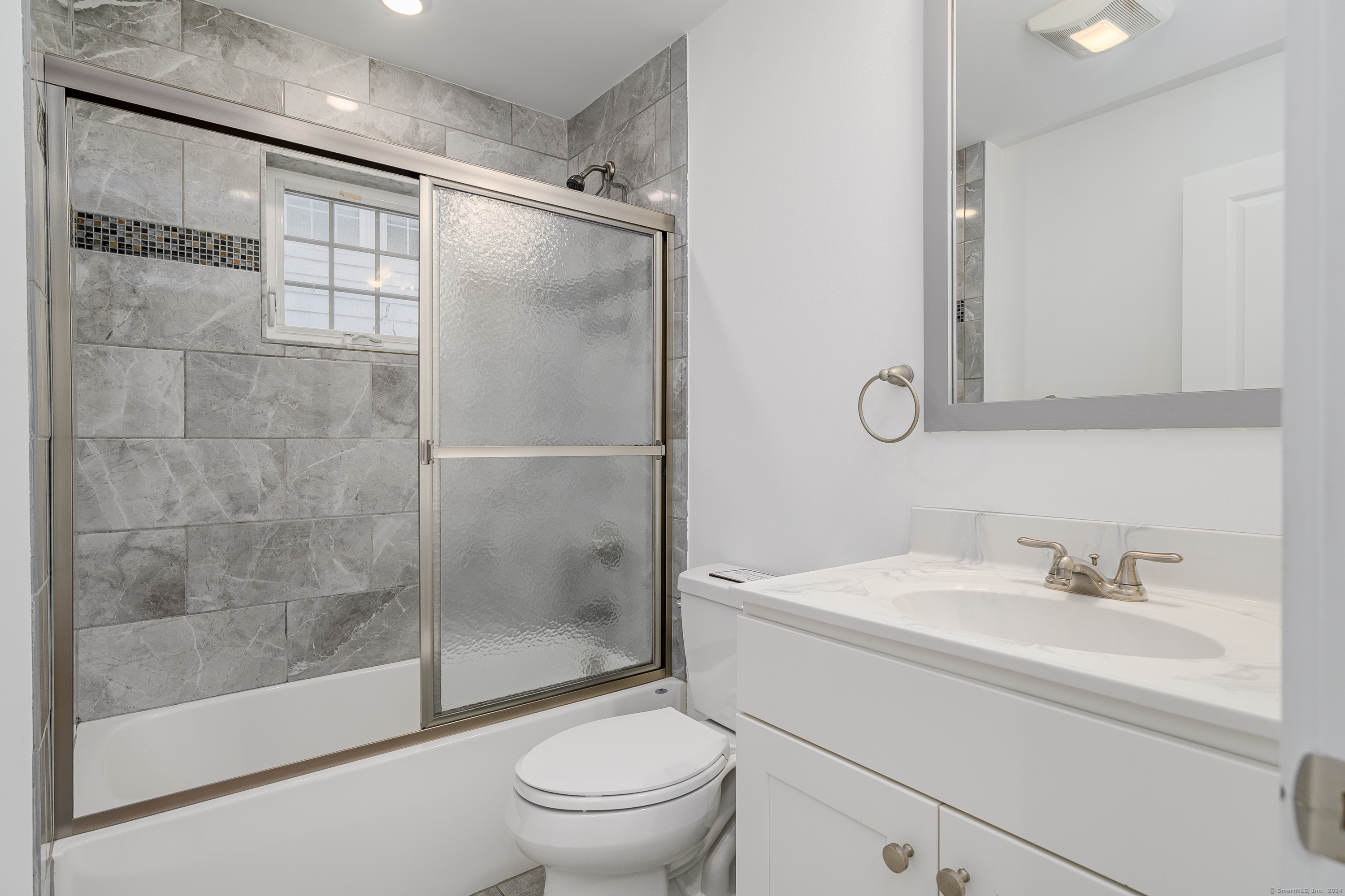 1033 Reef Road Fairfield, CT 06824 - Photo 5 of 32 a bathroom with a sink toilet and shower