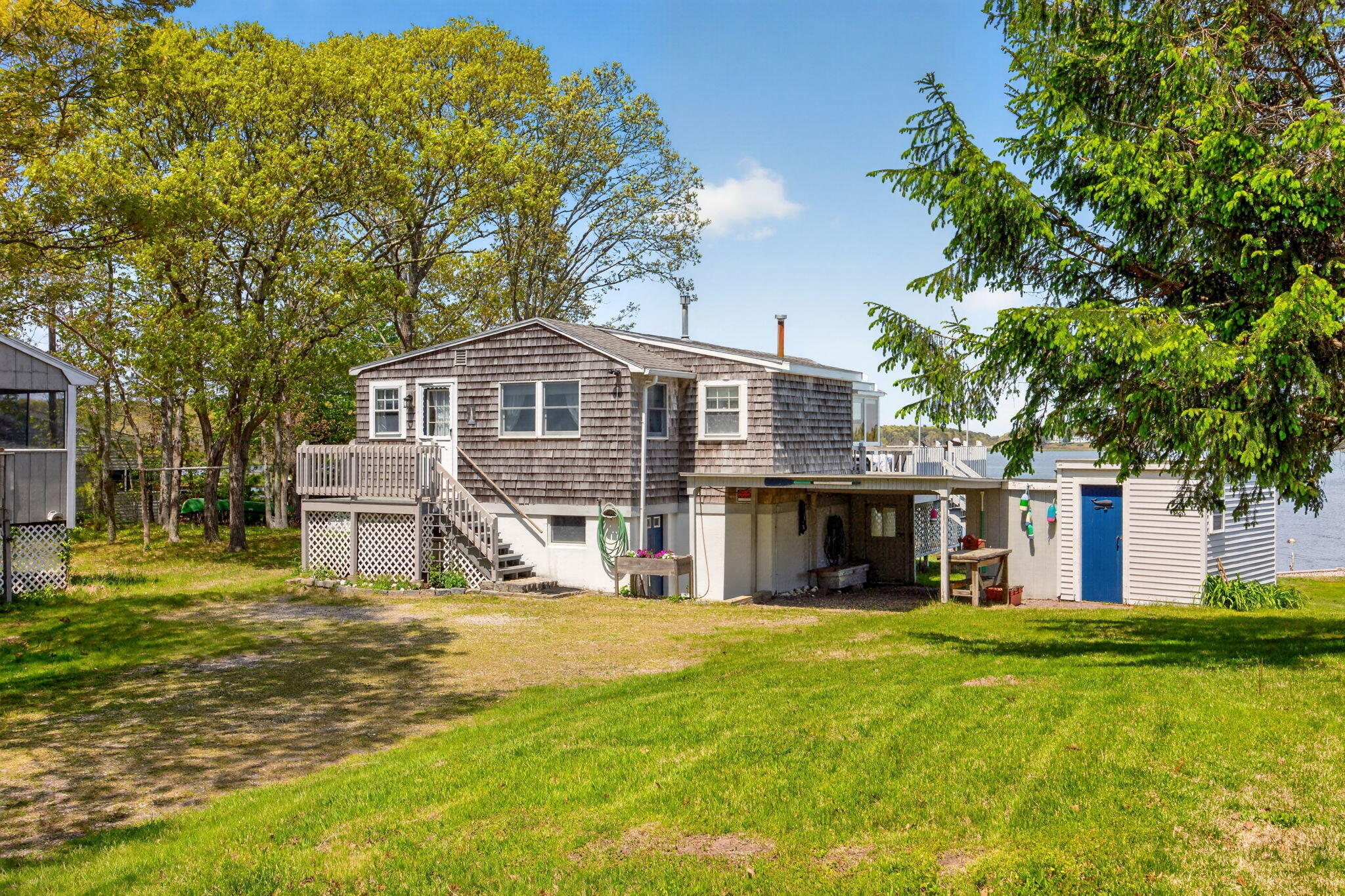 11 Clamshell Lane Mashpee, MA 02649 - Photo 42 of 43 a front view of a house with a garden