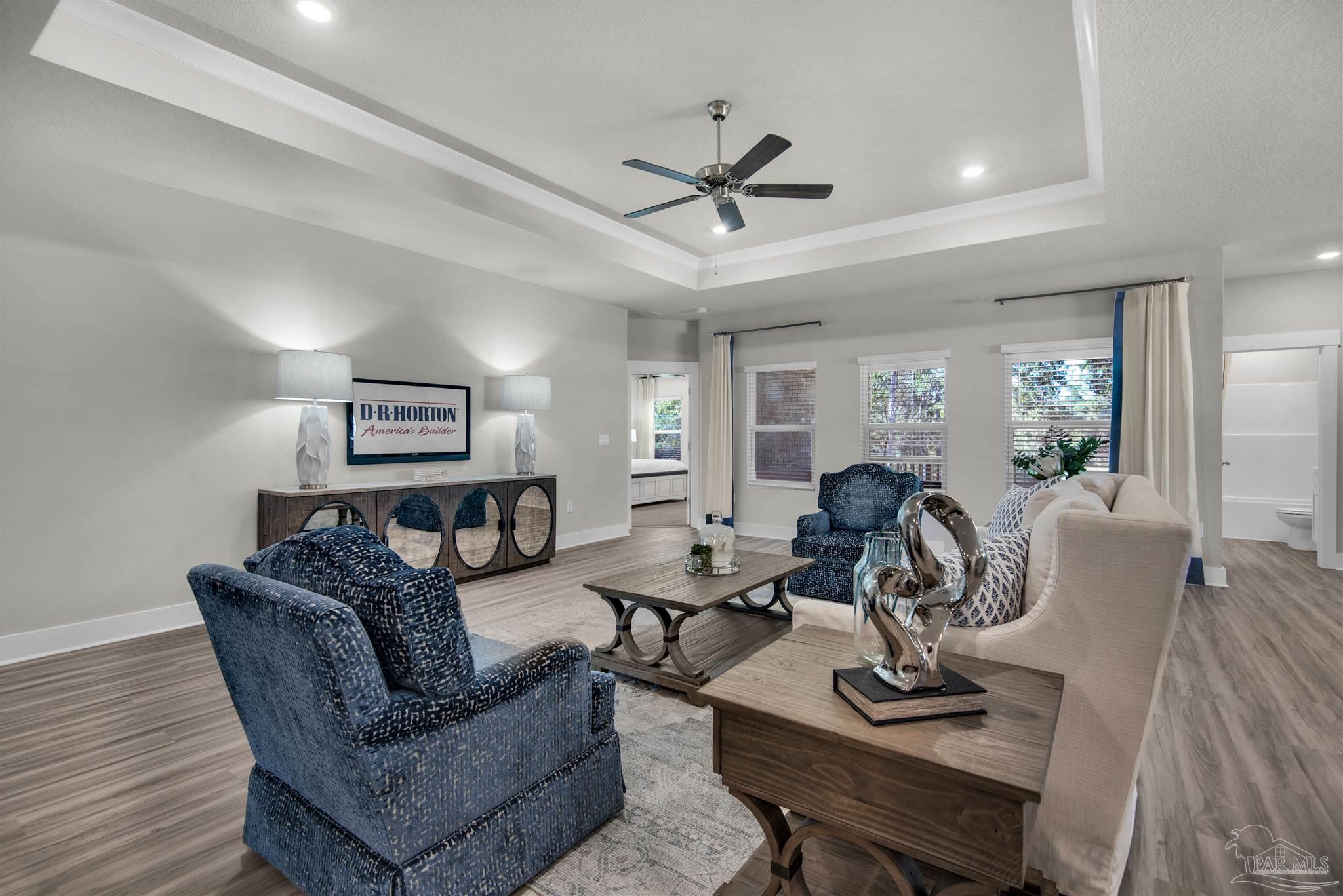 3269 Water Birch Road Cantonment, FL 32533 - Photo 17 of 45 a living room with furniture a two couches and a dining table with wooden floor