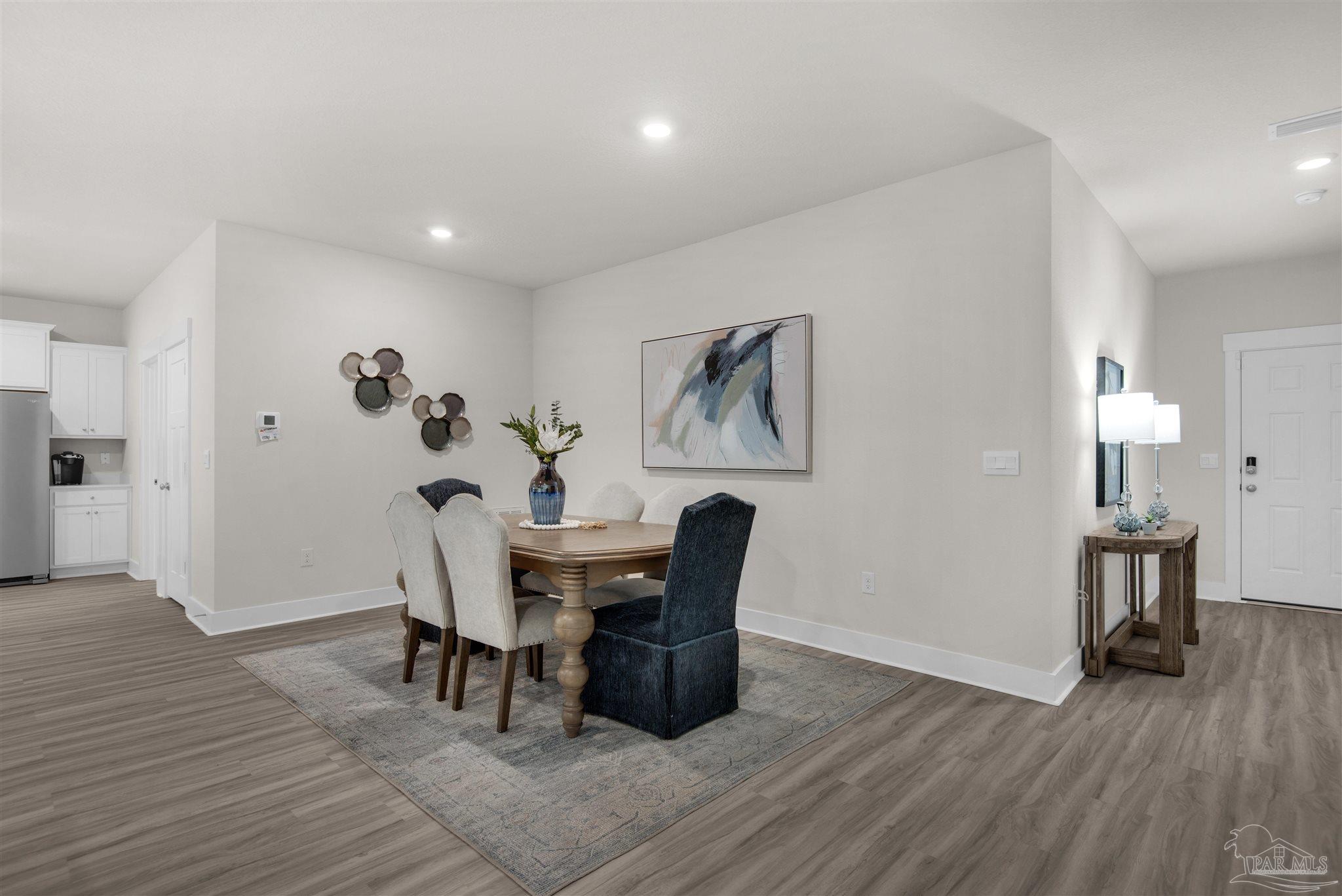 3269 Water Birch Road Cantonment, FL 32533 - Photo 20 of 45 a view of a dining room with furniture and wooden floor