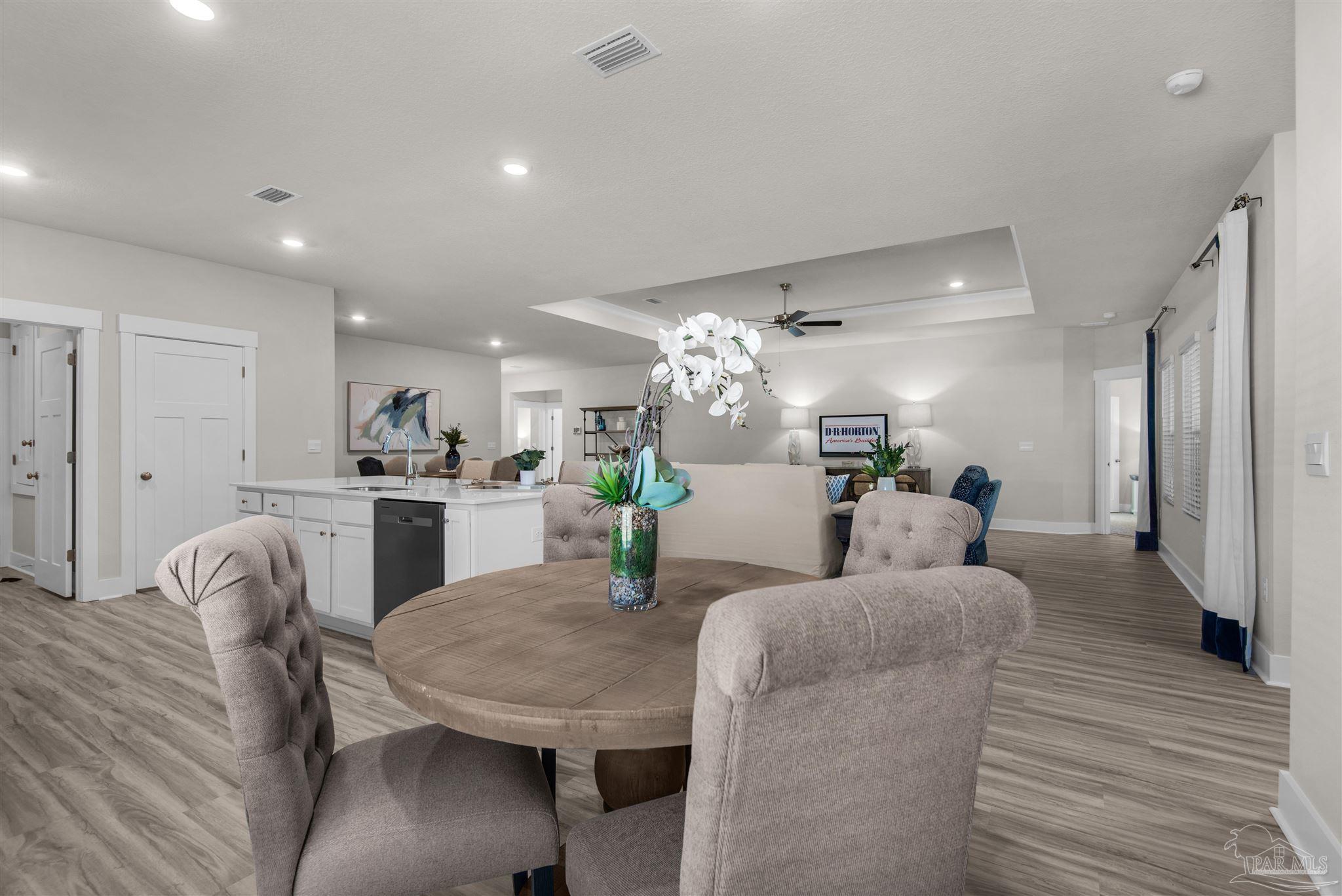 3269 Water Birch Road Cantonment, FL 32533 - Photo 30 of 45 a living room with furniture and a dining table with kitchen view