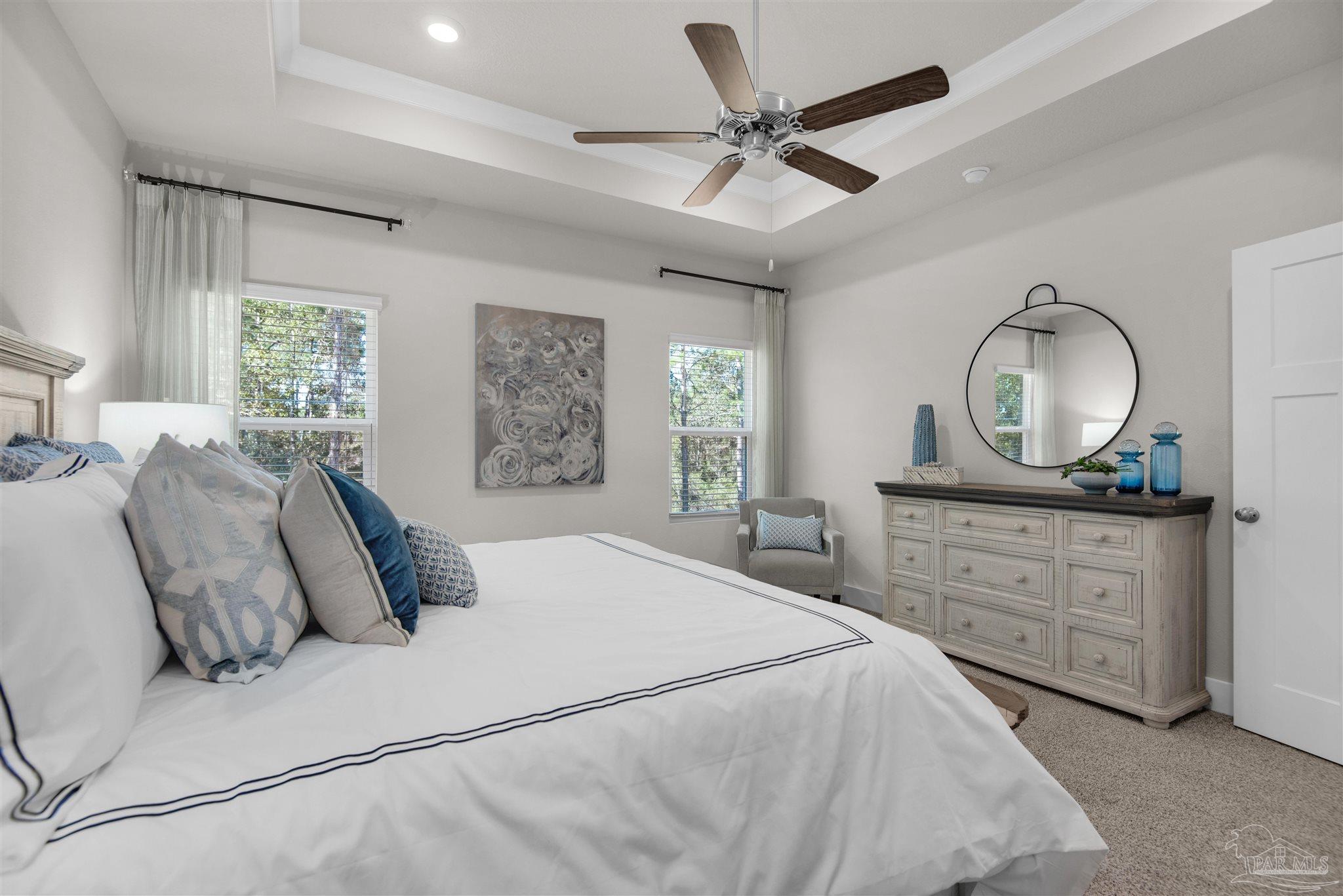 3269 Water Birch Road Cantonment, FL 32533 - Photo 32 of 45 a bedroom with a large bed and a mirror