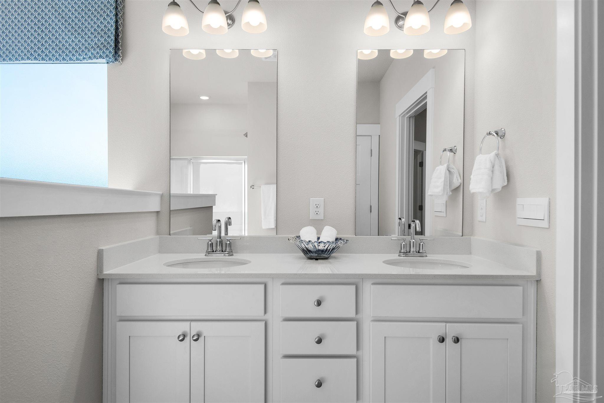 3269 Water Birch Road Cantonment, FL 32533 - Photo 37 of 45 a bathroom with a sink double vanity and a mirror