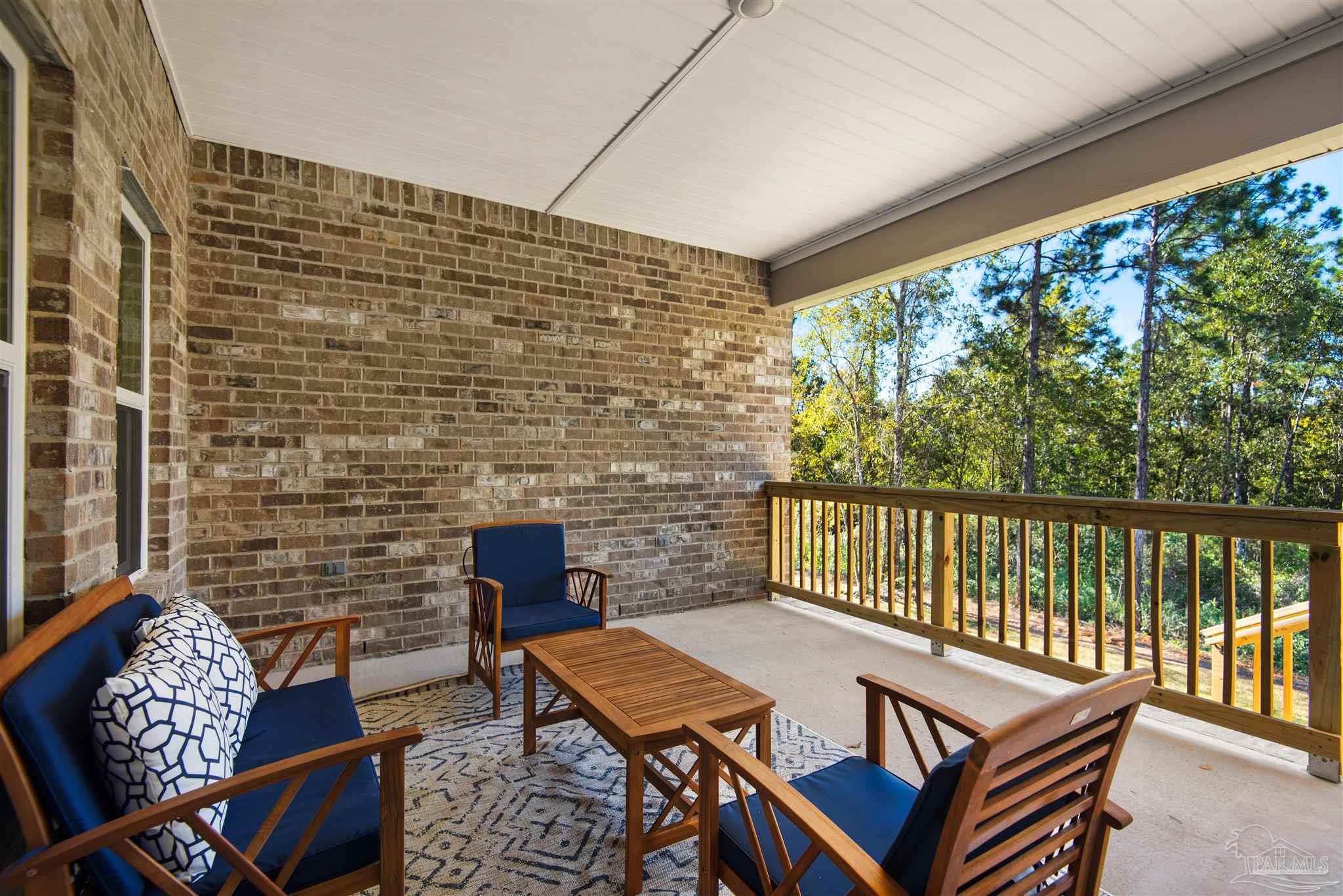 3269 Water Birch Road Cantonment, FL 32533 - Photo 38 of 45 a balcony with furniture and rug