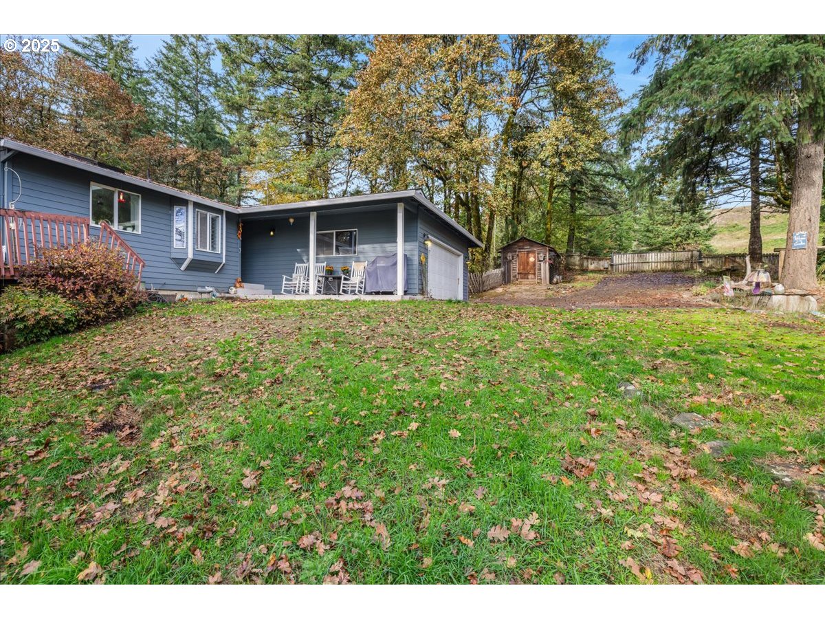 56220 Southwest Lee Falls Road Gaston, OR 97119 - Photo 2 of 44 a front view of a house with garden