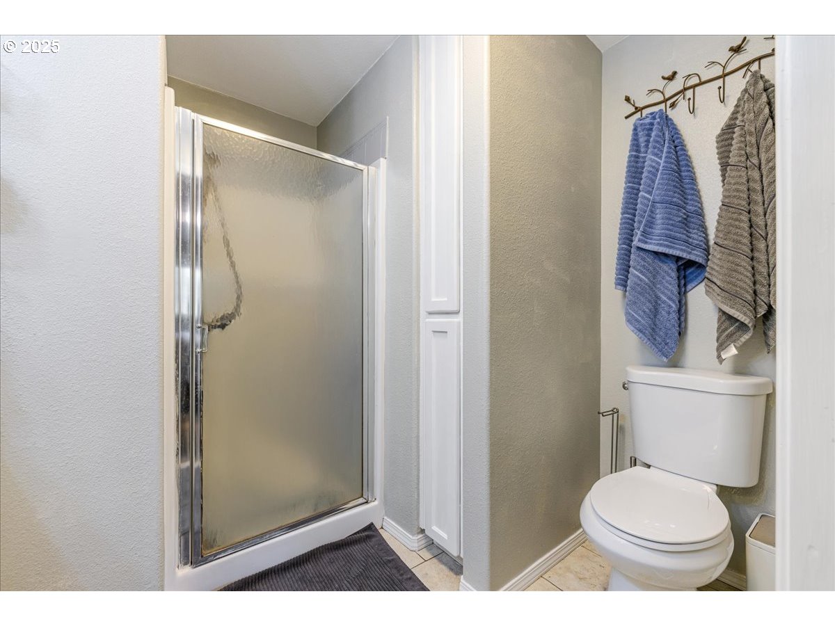 56220 Southwest Lee Falls Road Gaston, OR 97119 - Photo 23 of 44 a bathroom with a toilet and a shower