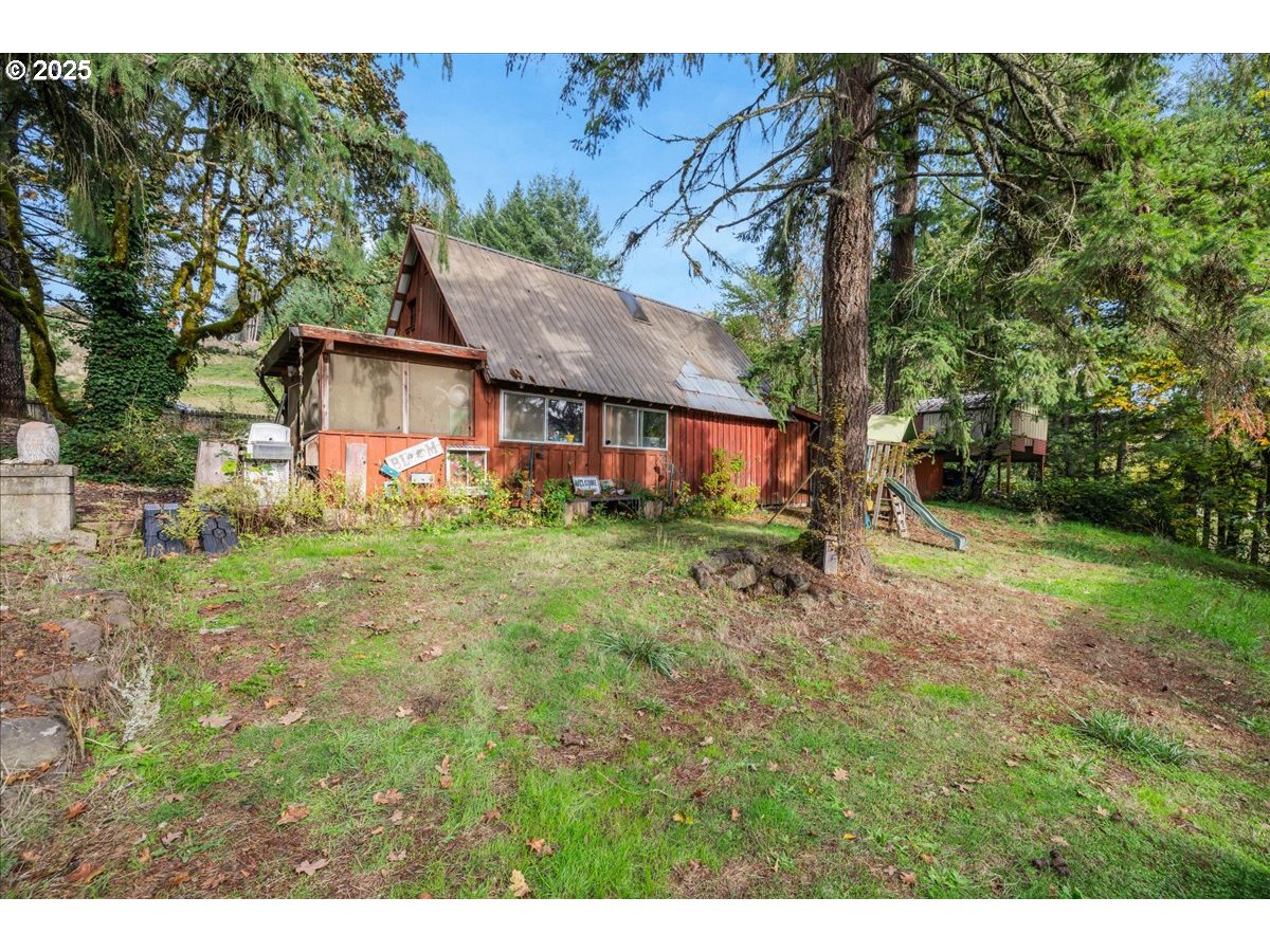 56220 Southwest Lee Falls Road Gaston, OR 97119 - Photo 33 of 44 a view of a house with yard and tree s