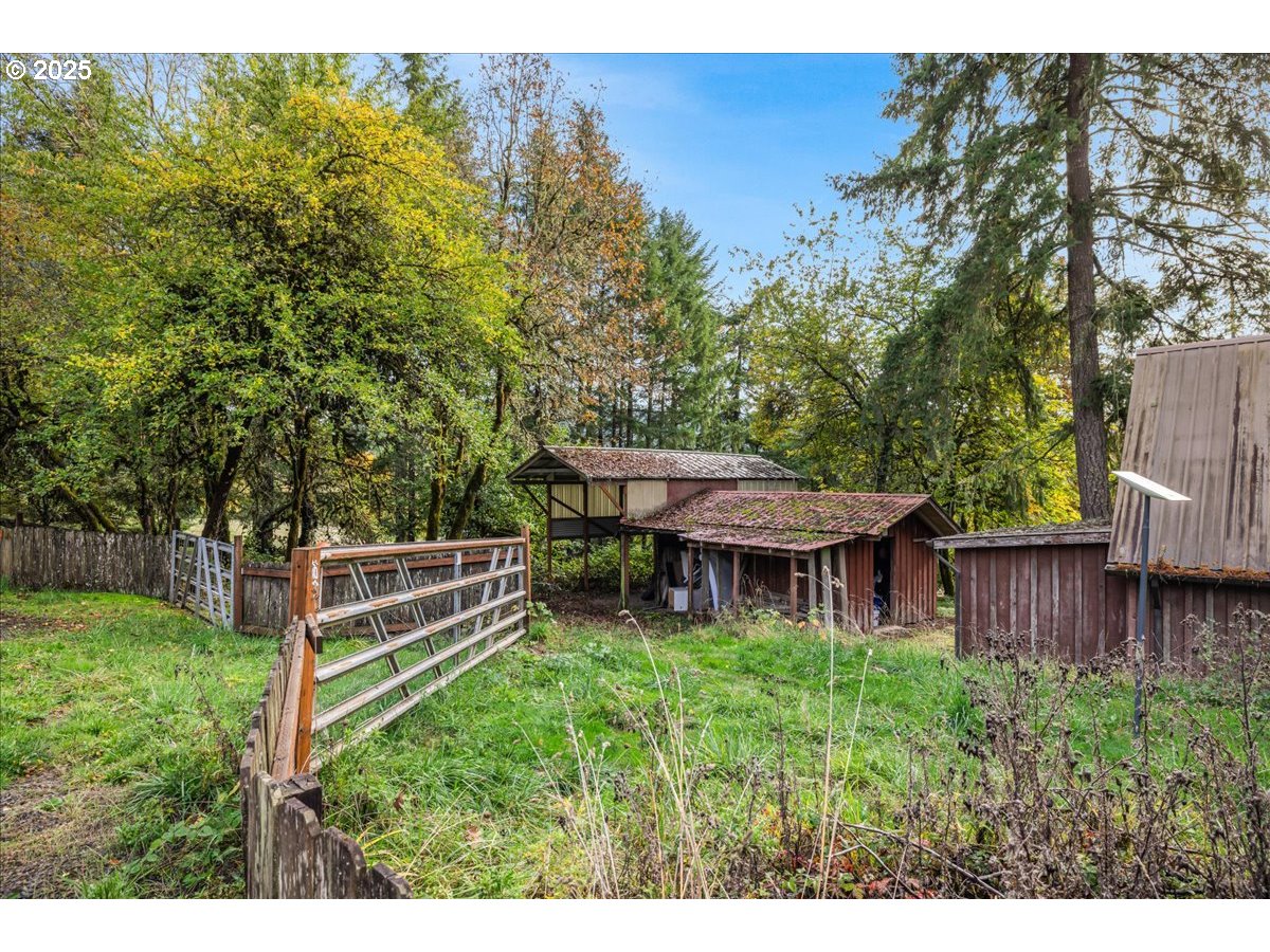 56220 Southwest Lee Falls Road Gaston, OR 97119 - Photo 35 of 44 a view of a house with backyard and sitting area
