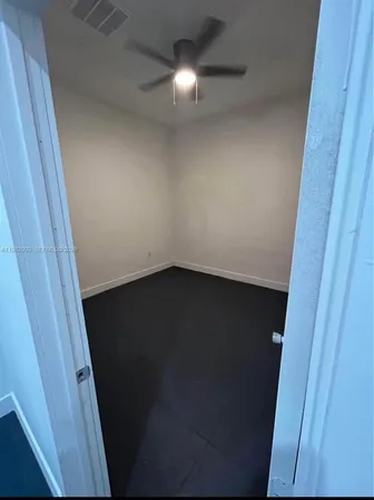 a dining room with a table and chairs