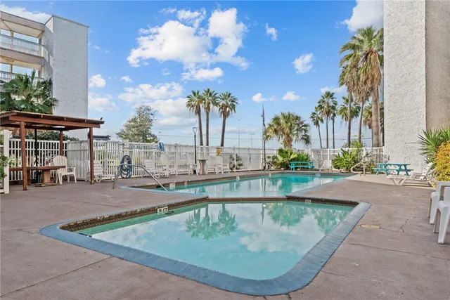 a view of a patio with a table and chairs