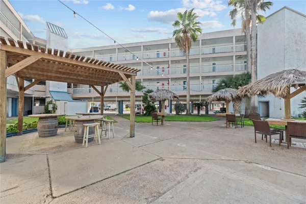 a view of swimming pool with outdoor seating