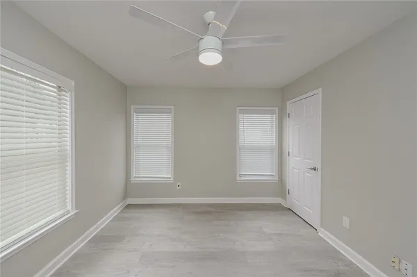 a view of an empty room with a window