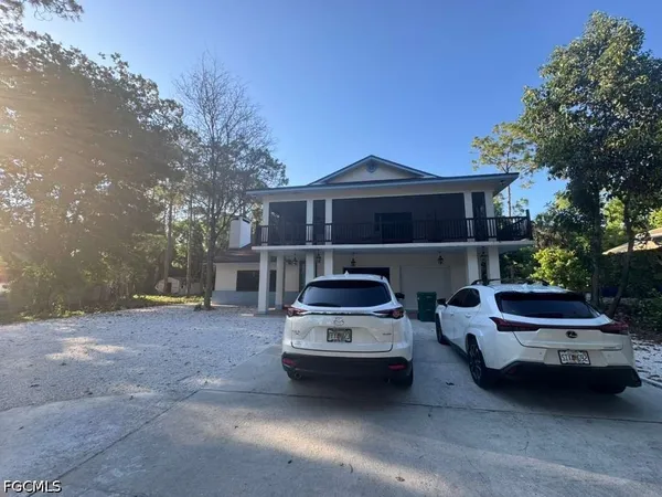 a car parked in front of a house