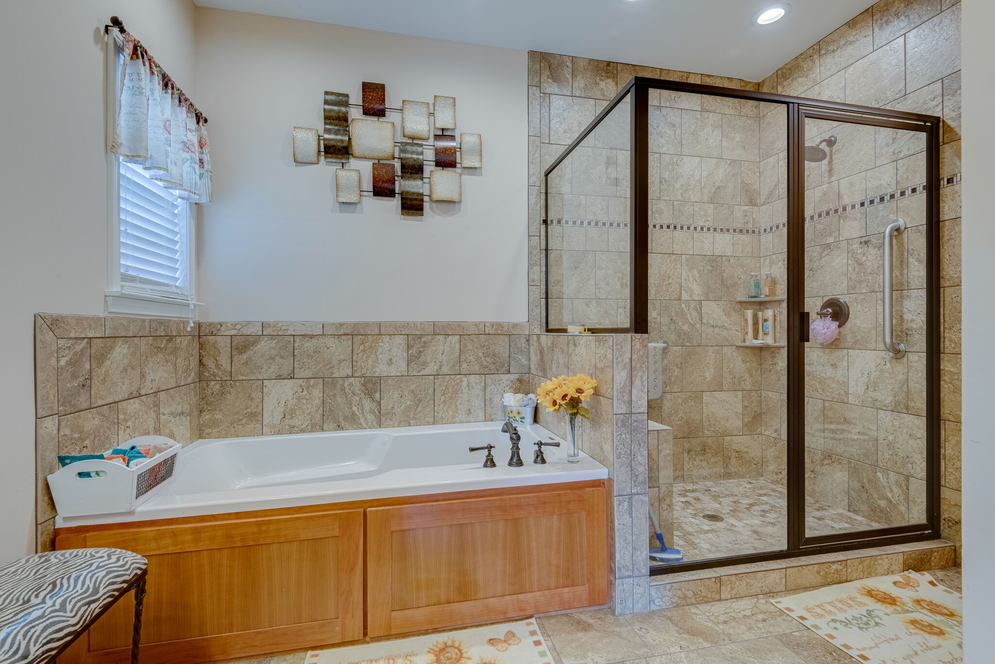932 Goslin Branch Road Burns, TN 37029 - Photo 17 of 24 a bathroom with a tub a sink and glass door shower