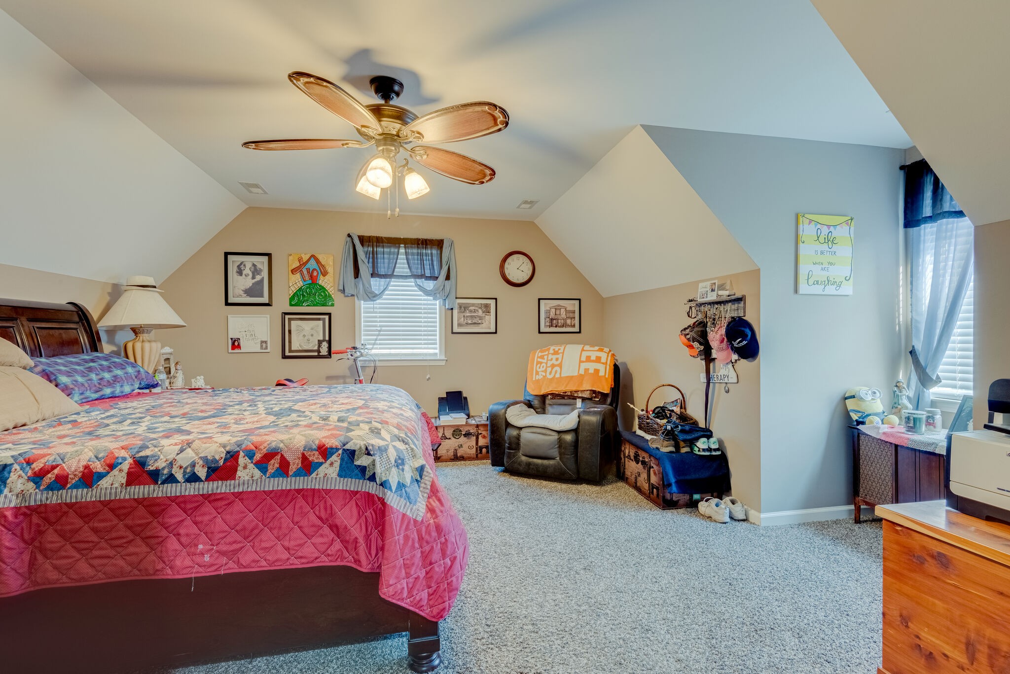 932 Goslin Branch Road Burns, TN 37029 - Photo 21 of 24 a bedroom with a bed and a chandelier