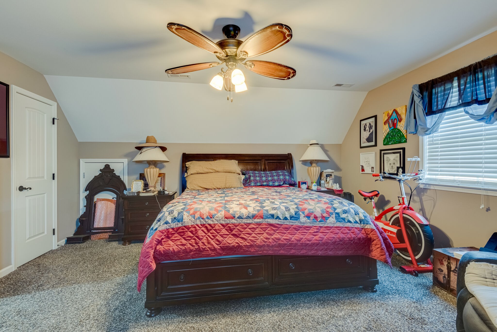 932 Goslin Branch Road Burns, TN 37029 - Photo 22 of 24 a bedroom with a bed and a chandelier