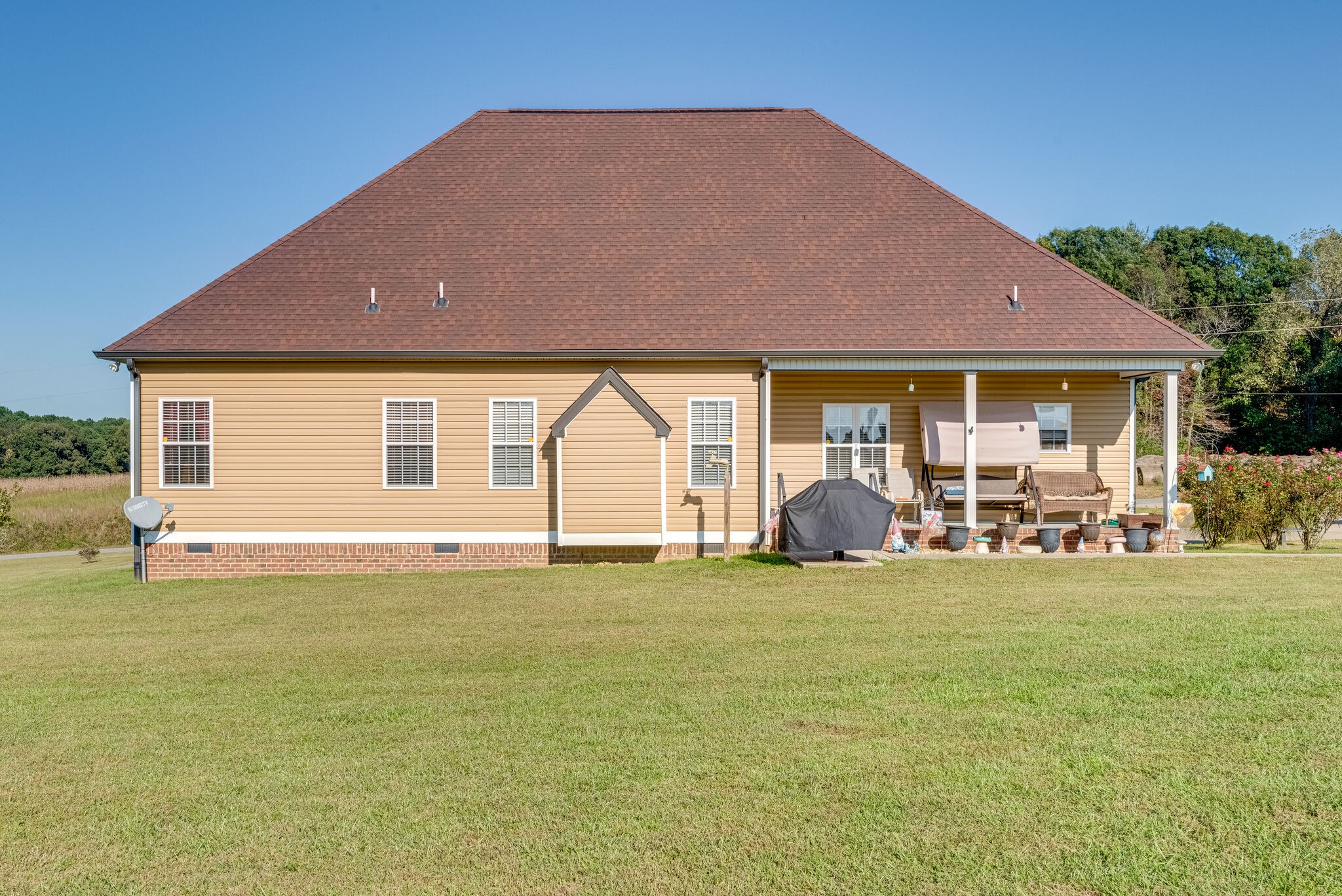 932 Goslin Branch Road Burns, TN 37029 - Photo 23 of 24 a view of a house with backyard and porch