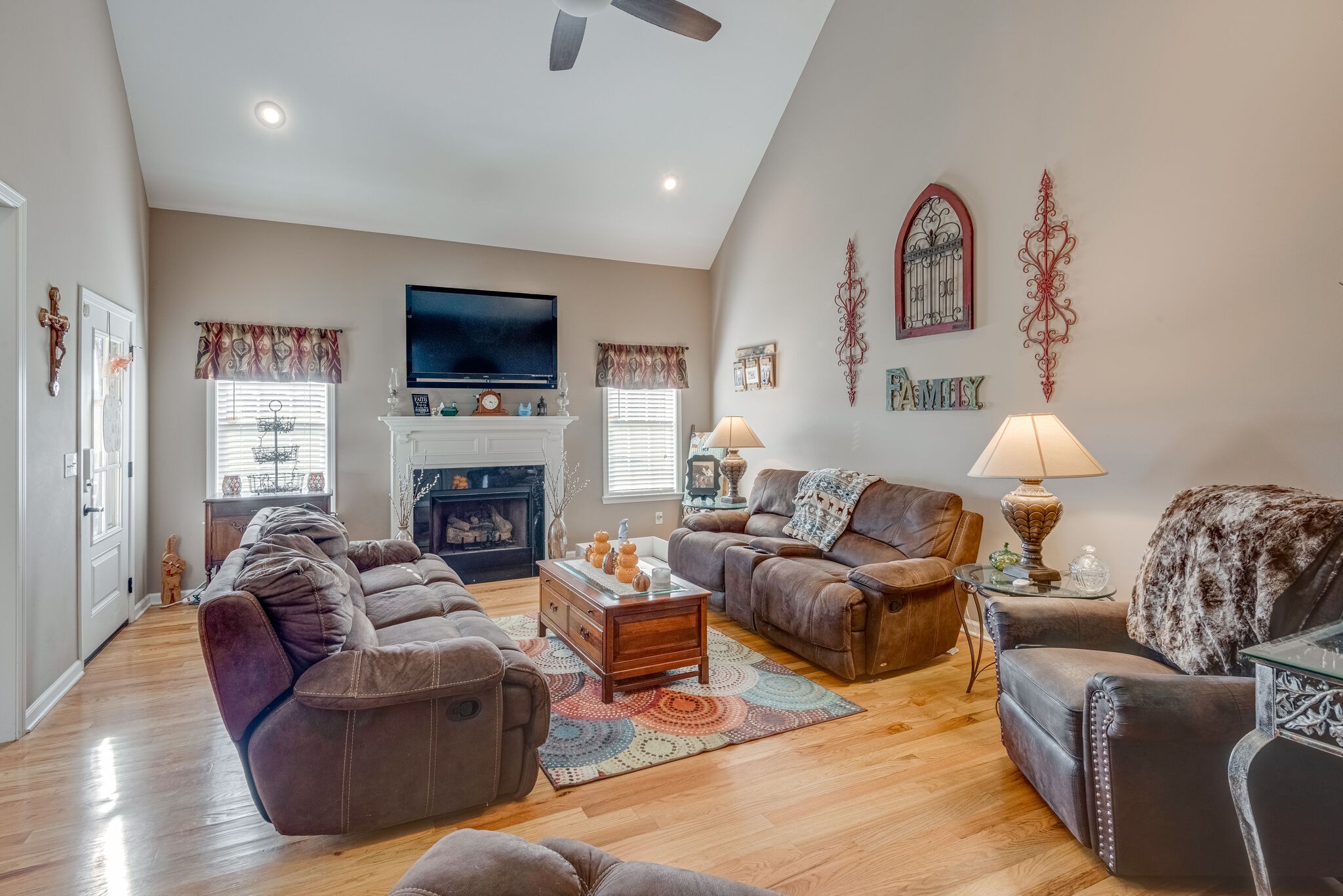 932 Goslin Branch Road Burns, TN 37029 - Photo 5 of 24 a living room with furniture a flat screen tv and a fireplace
